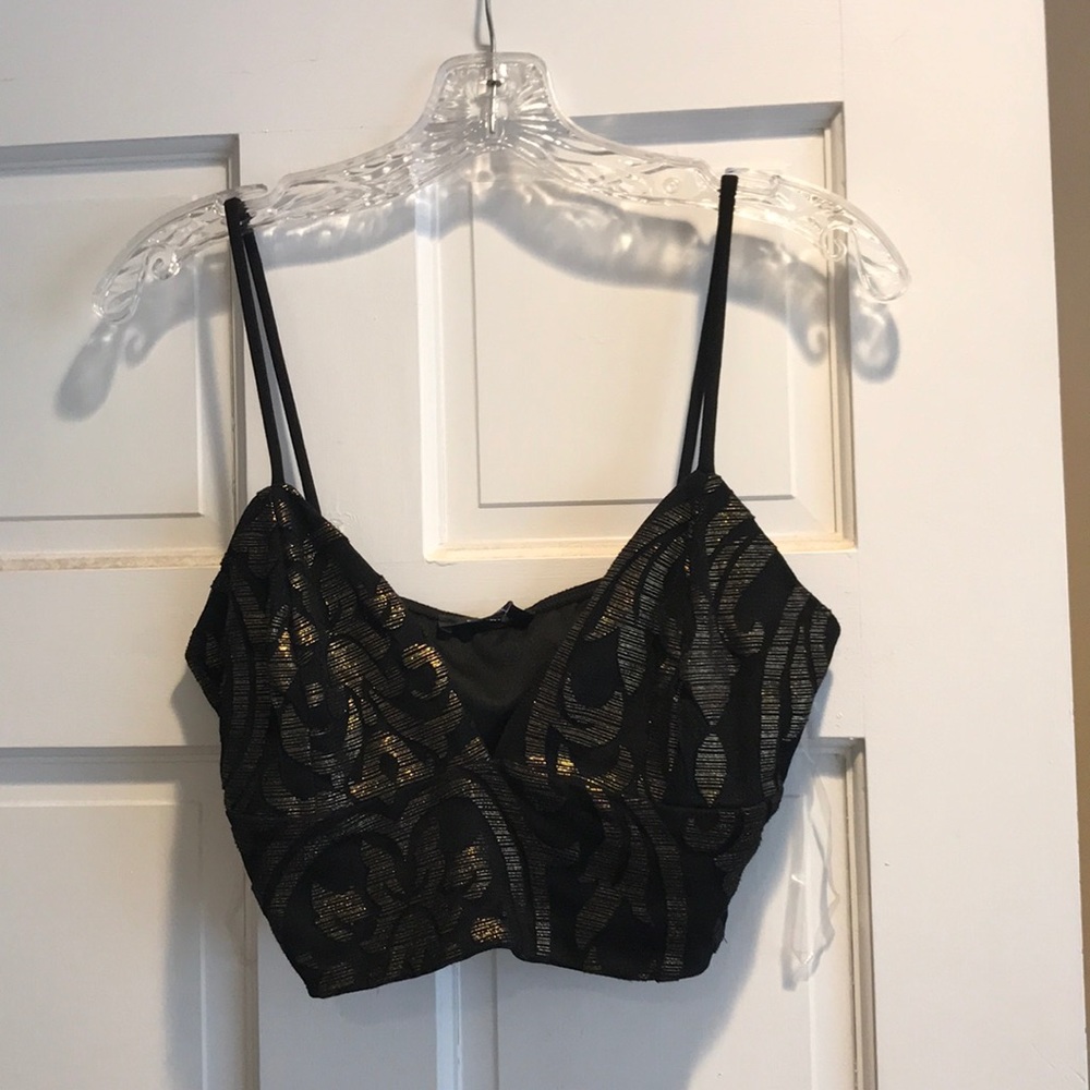 Black crop top with a gold design